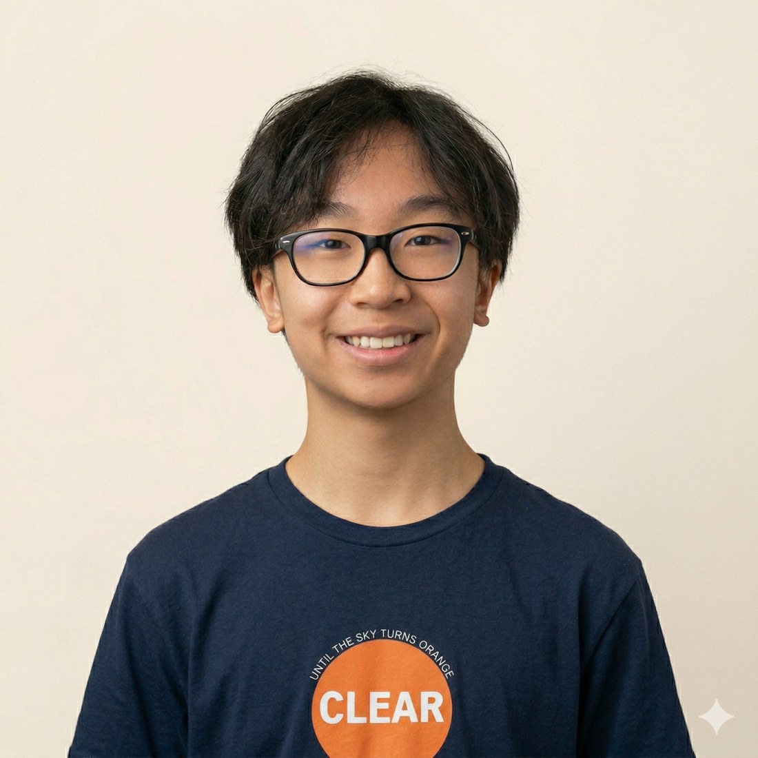 Hugo Bui, wearing a navy CLEAR25 shirt reading Until The Sky Turns Orange